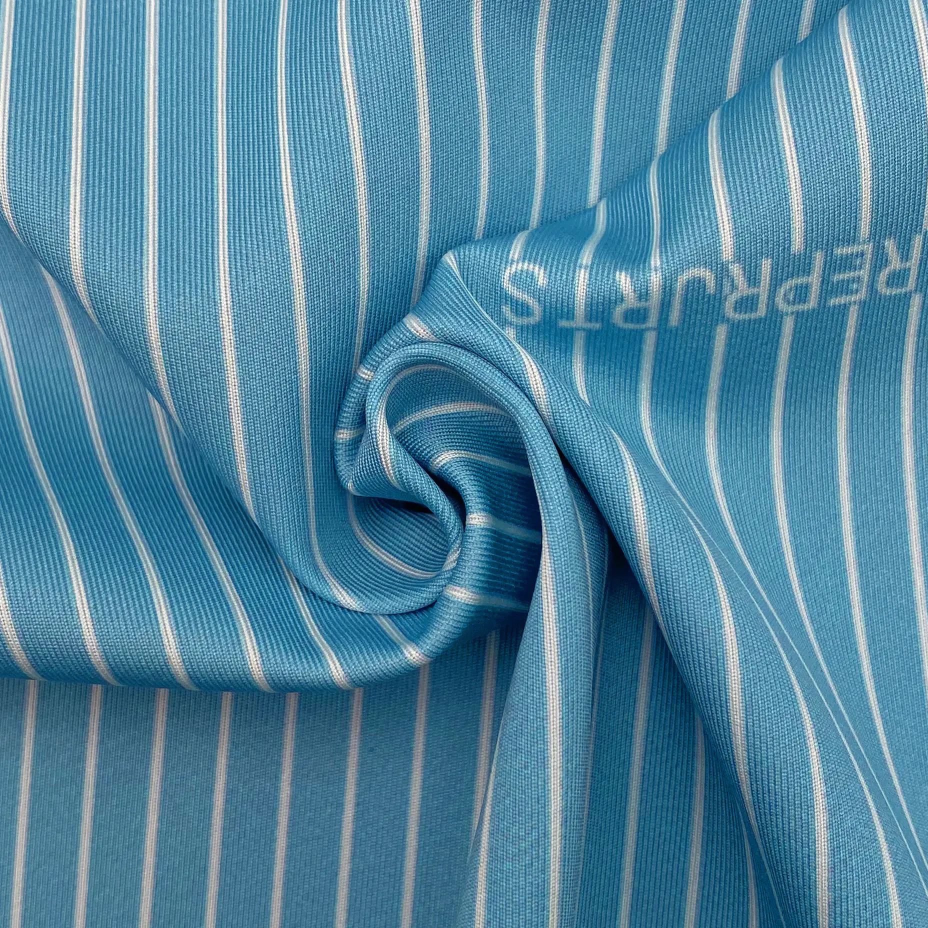 KAIN INTERLOCK BERGARIS BIRU DAN PUTIH