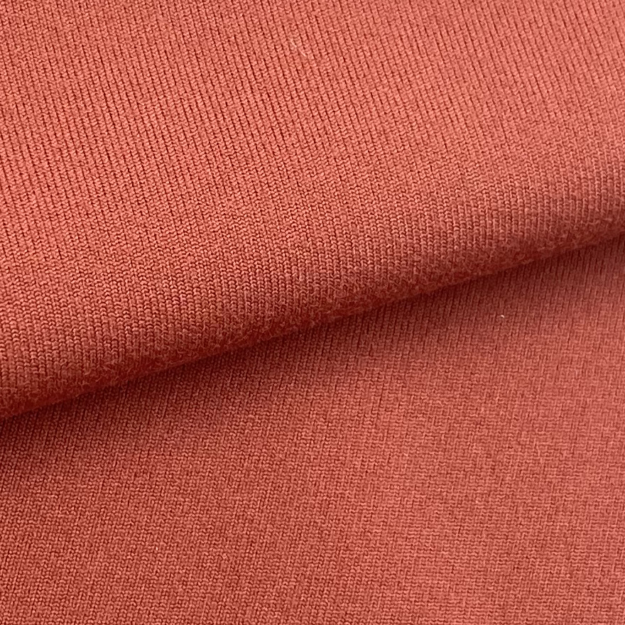 KAIN INTERLOCK MERAH BATA